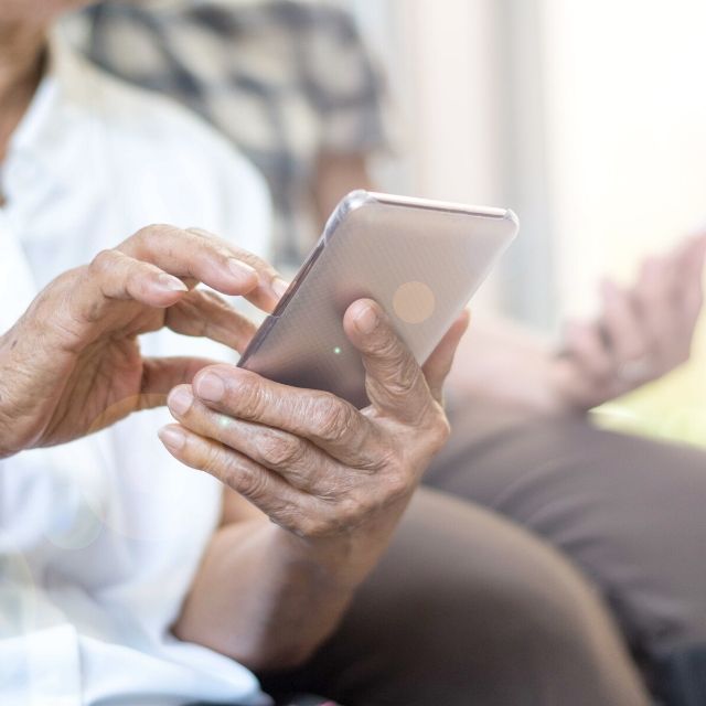 senior couple with smart phones